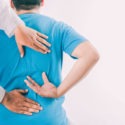 chiropractor helping a patient with back pain