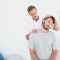 male patient receiving chiropractic adjustment